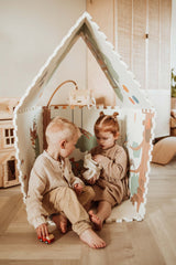 EEVAA Treehouse puzzlemat, mat made in a playhouse, children are sitting in the playhouse