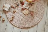 soft stripes brown organic babymat, child is sitting on the mat, playing with a banana, wooden toys, mouse cuddles