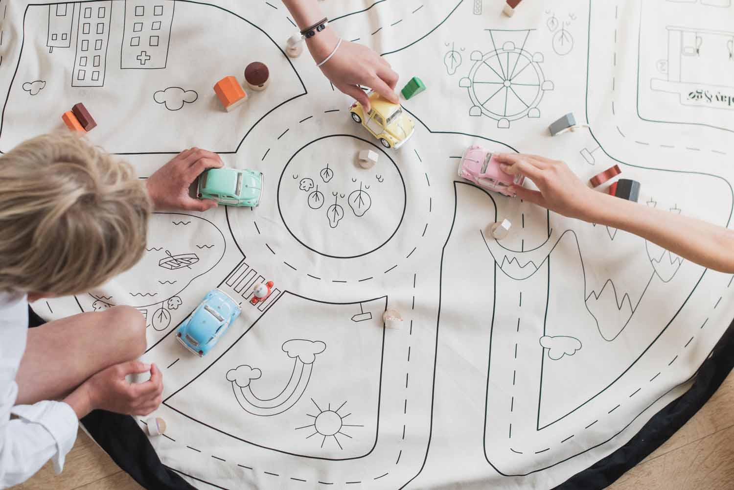 toy storage bag, open mat with roadmap, children playing with wooden toys