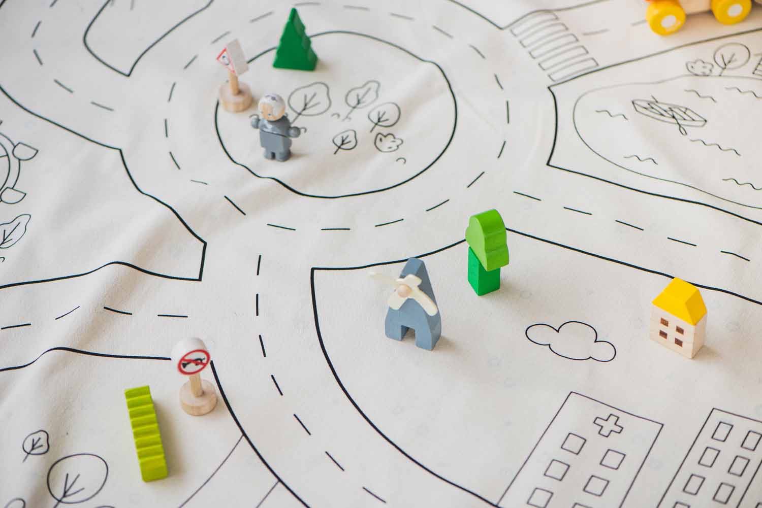 detail picture of playville storage bag, little wooden toys on the open mat