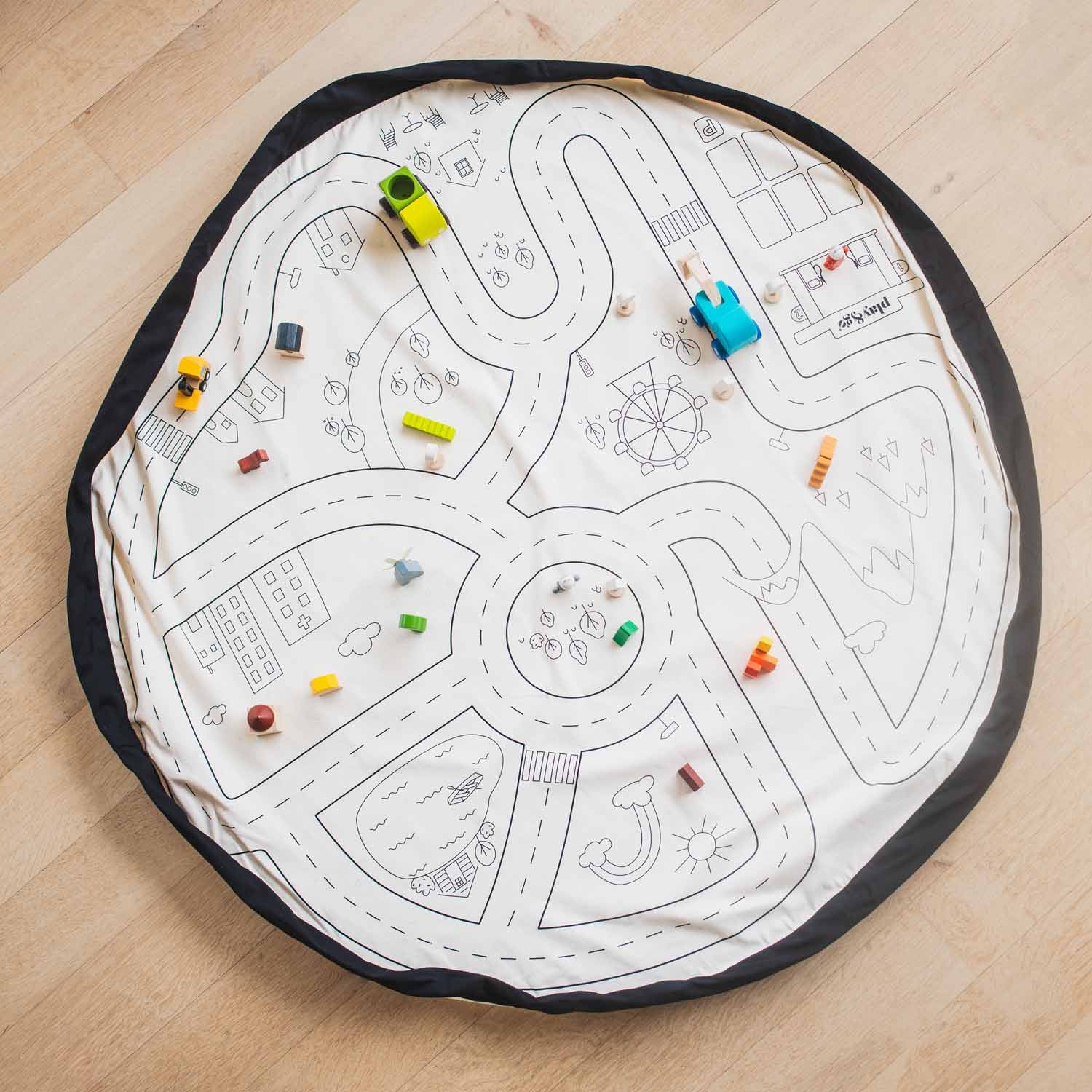 toy storage bag, open mat, road side, wooden cars