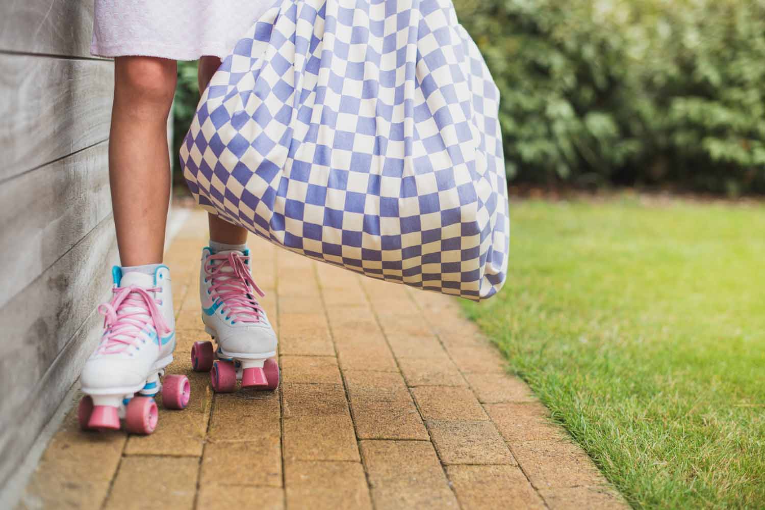 vichy purple storage bag, child on roller skates is carrying the bag