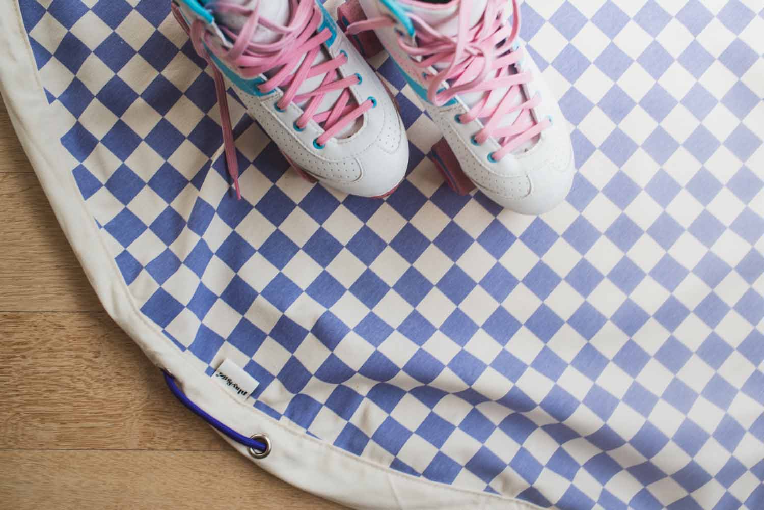 vichy purple storage bag, roller skates on top of the bag