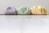 vichy toy storage bags, closed on floor, put next to each other