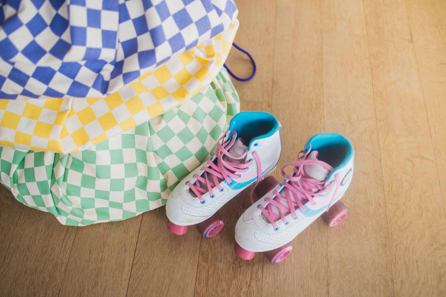 vichy storage bags piled on top of each other, roller skates