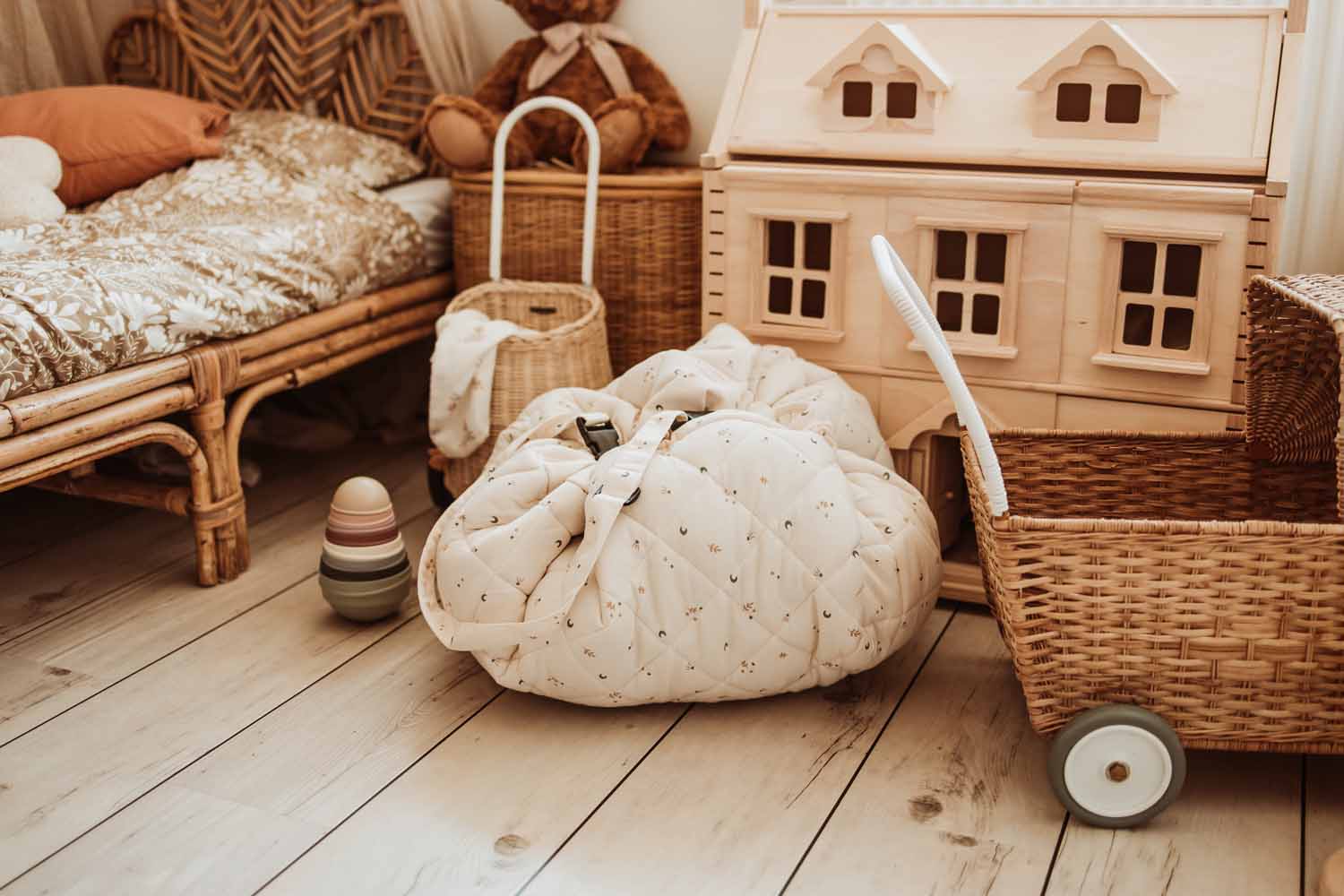 Moon organic babymat, closed on floor in kidsroom next to bed, stroller and victorian playhouse