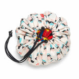 supergirl mini toy storage bag, filled with lego
