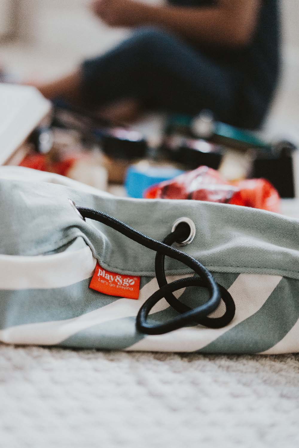 detail picture of  toy storage bag and play mat, green stripes