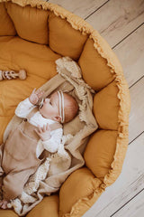Bloom mustard organic babymat, little baby sleeping on blanket on mat