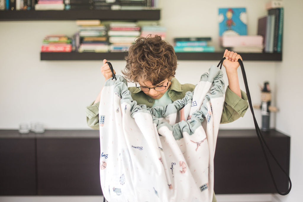 stylish designed Paris Map toy storage bag, child looking in the bag, livingroom