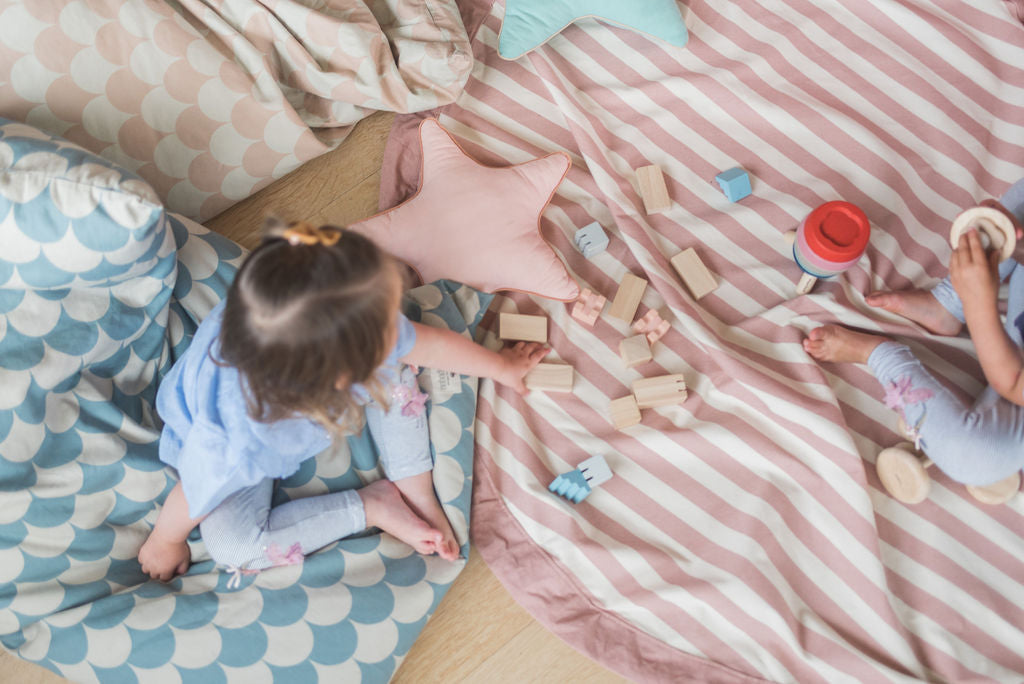 Stripes Pink New toy storage bag, children playing on mat with wooden toys, star pillows on the mat
