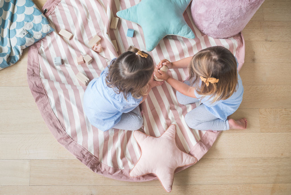 Stripes Pink New toy storage bag, children playing on mat with wooden toys, star pillows on the mat