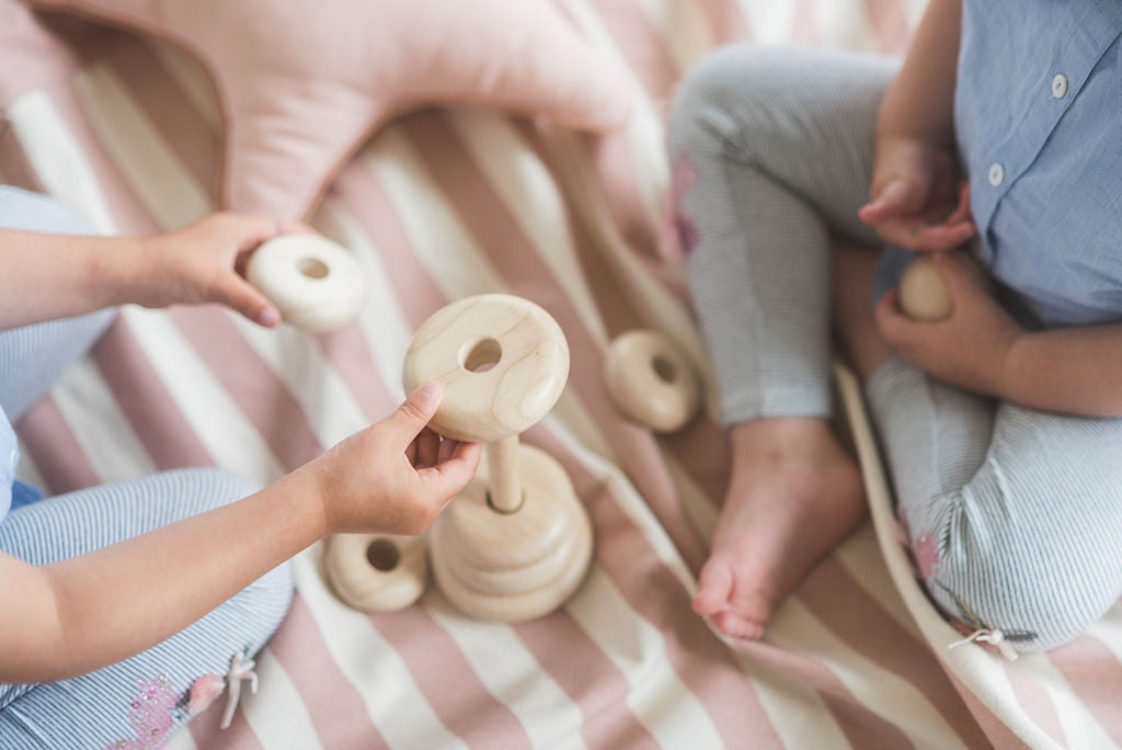 Stripes Pink New toy storage bag, children playing on mat with wooden toys, star pillow on the mat