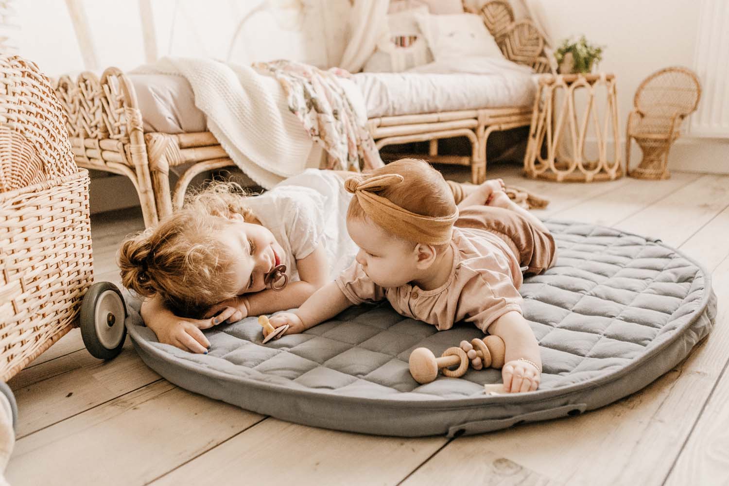 Meadow Green soft padded baby play mat, open mat lying on the floor in kidsroom, children lying on the mat