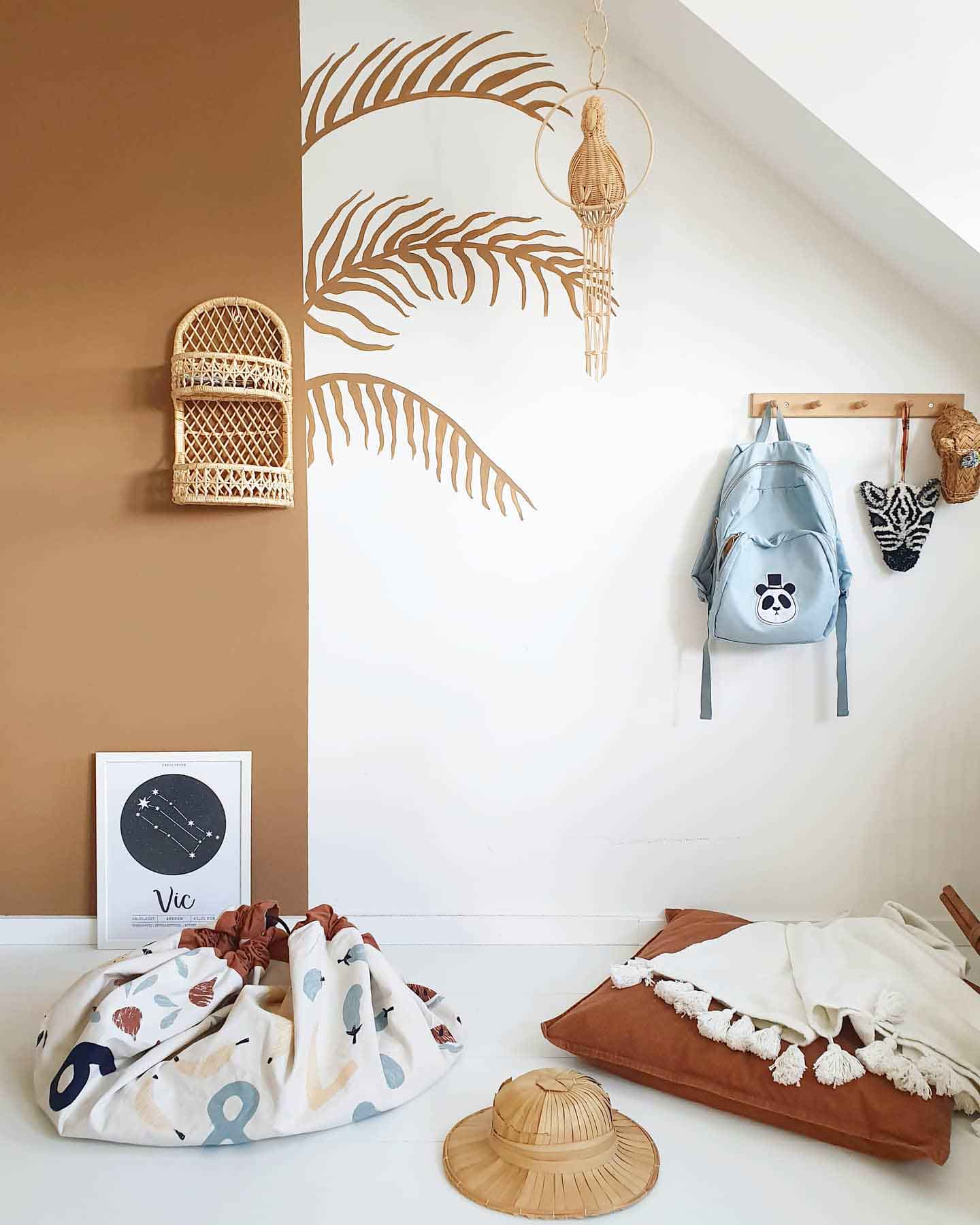 veggie numbers toy storage bag, closed bag on floor in kidsroom, next to pillow, little blanket, wooden head, wooden parrot