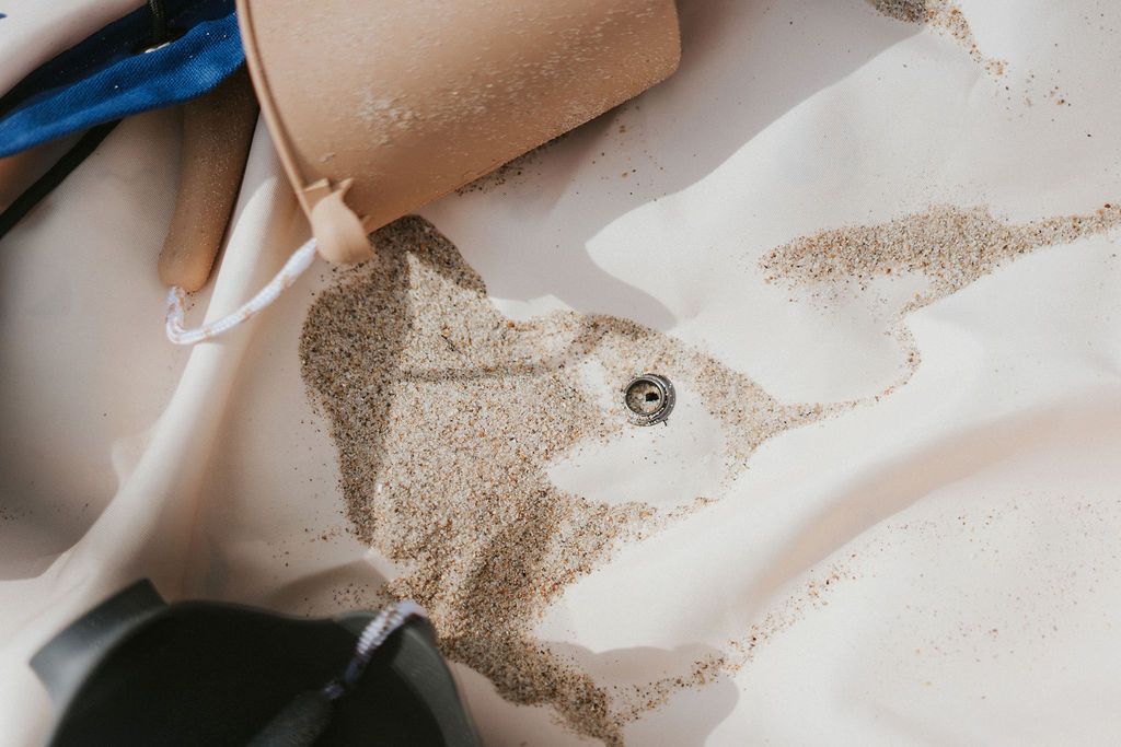 Play&Go outdoor storage bag and play mat, sand between the toys on the mat