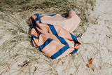 Play&Go outdoor storage bag and play mat, mokka stripes, lying in the dunes