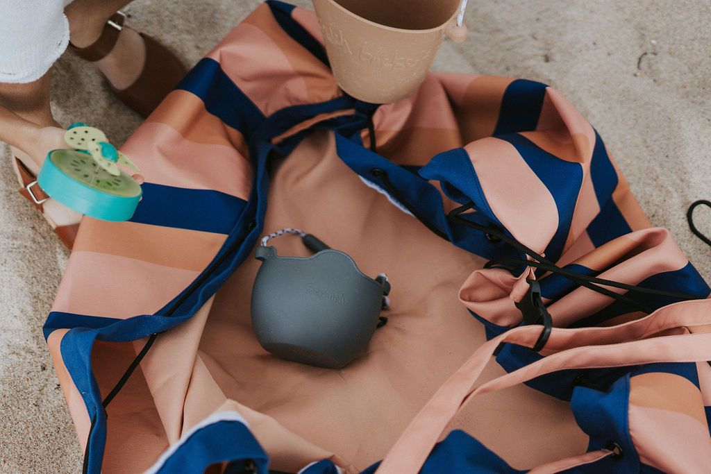 mokka stripes outdoor beach bag, child playing in the sand with beach toys