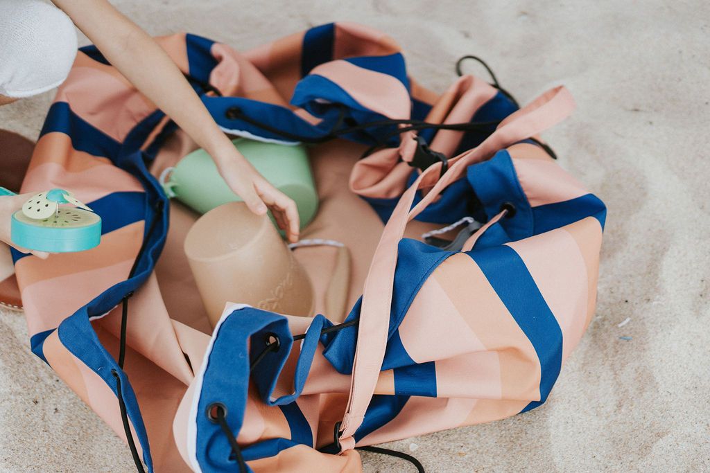 mokka stripes outdoor beach bag, child playing in the sand with beach toys