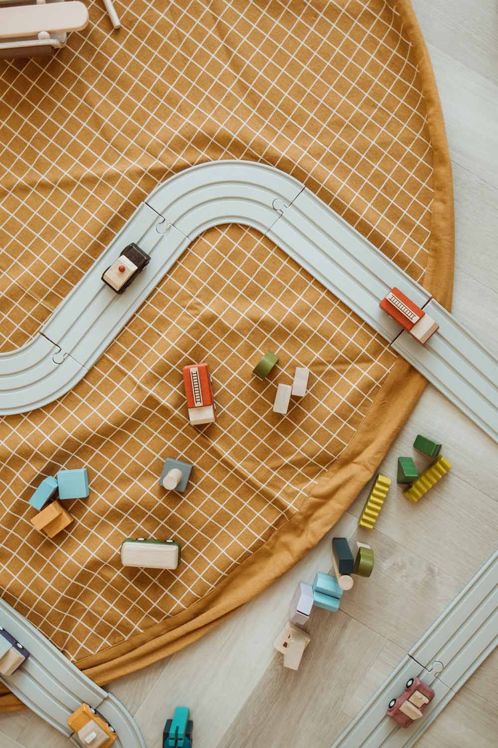 open organic grid mustard storage bag, wooden toys, road with wooden cars