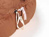 brown baby mat, crib, detail of closure