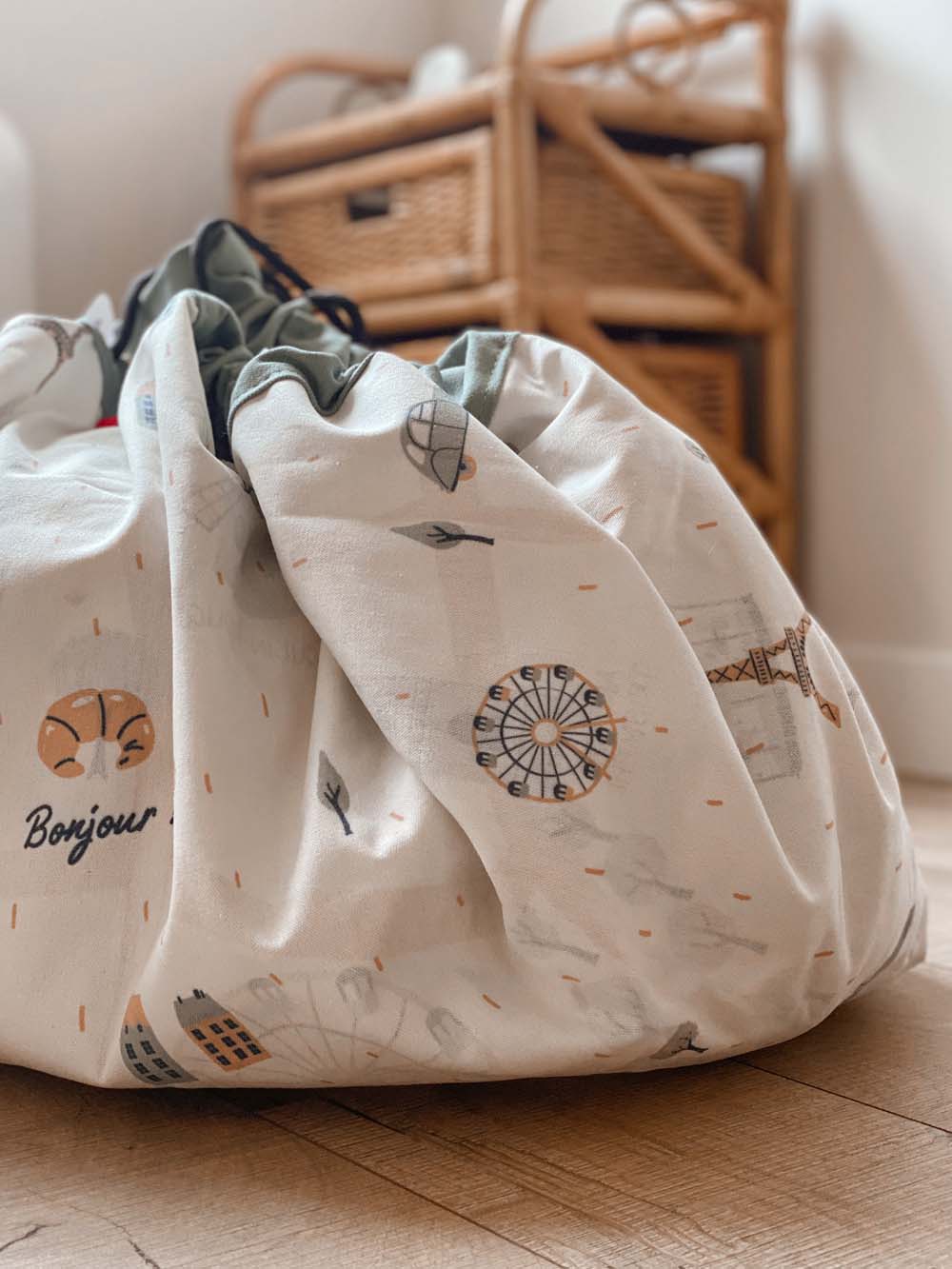 stylish designed Paris Map toy storage bag, closed bag in kidsroom, next to wooden closet