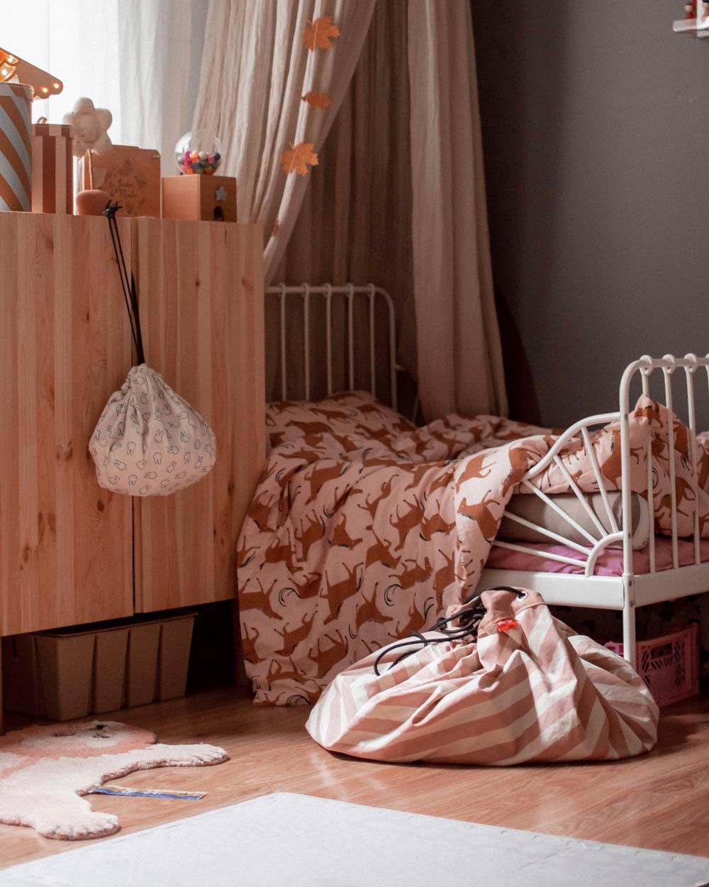 stripes pink new storage bag, closed bag on floor next to bed in kidsroom, miffy mini bag closet hanging on closet