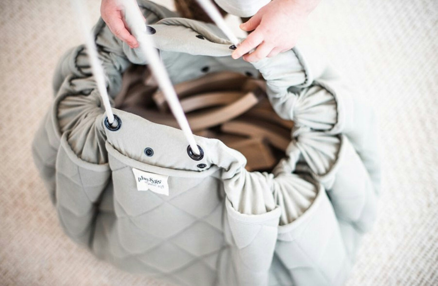 Play&Go organic baby mat, filled with wooden toys