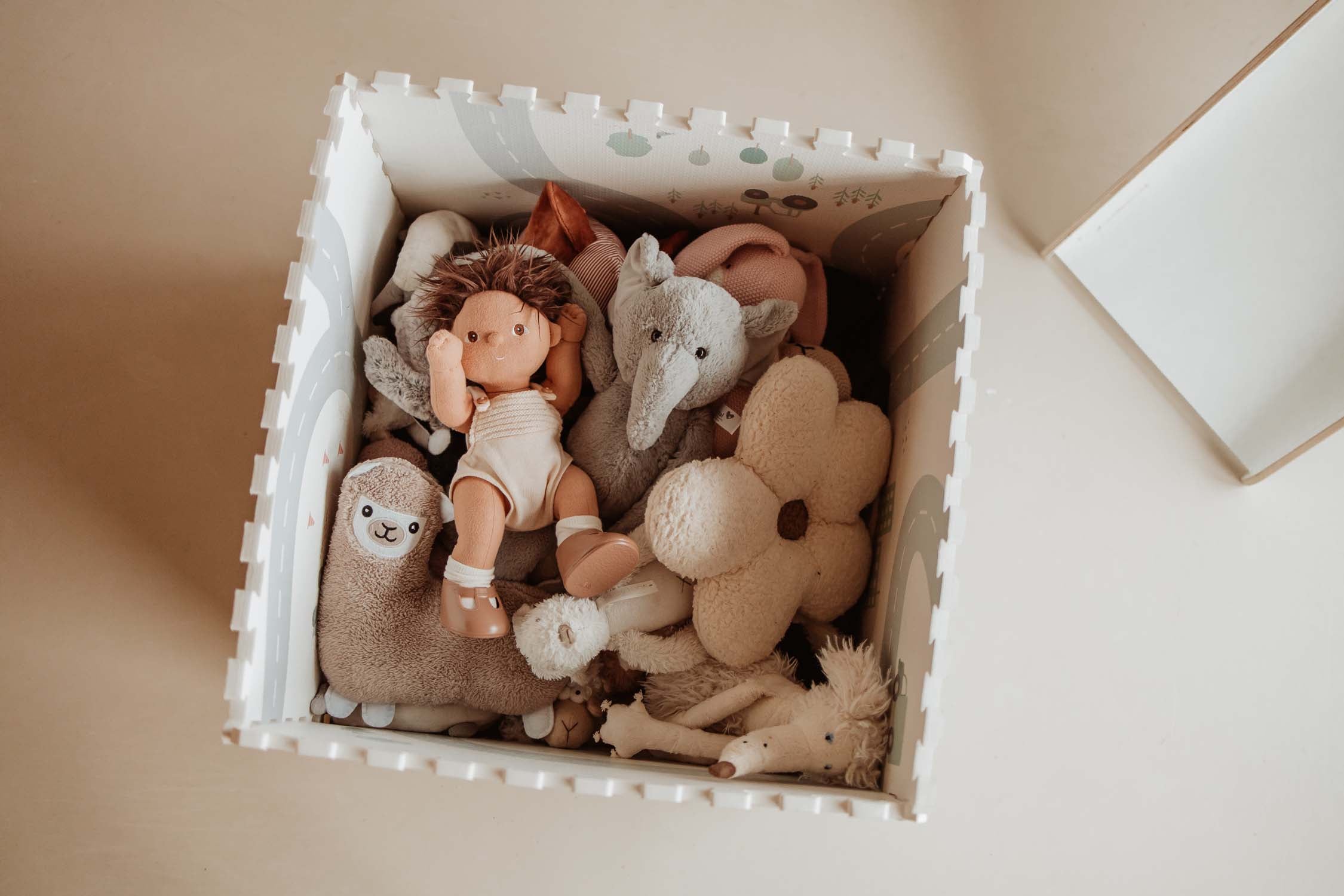 box made of roadmap puzzlemat, filled with cuddles